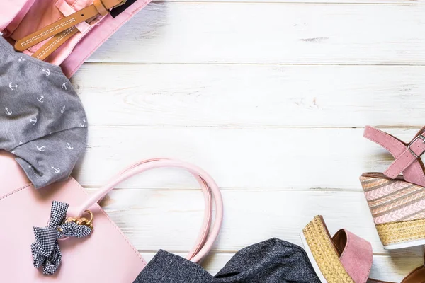 Woman clothes and accessories in pink and gray colors — Stock Photo, Image