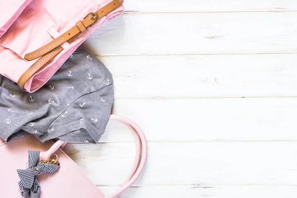 Woman clothes and accessories in pink and gray colors — Stock Photo, Image