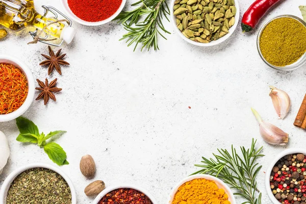 Spices and herbs on white stone table. — Stock Photo, Image