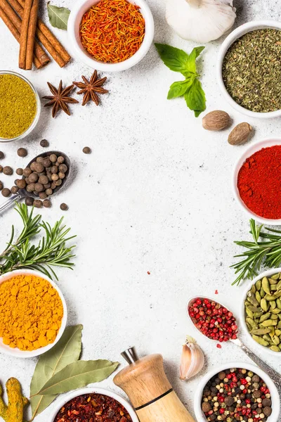 Spices and herbs on white stone table. — Stock Photo, Image