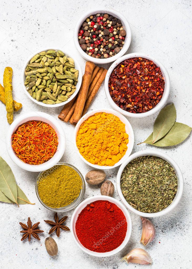 Spices on white stone table.