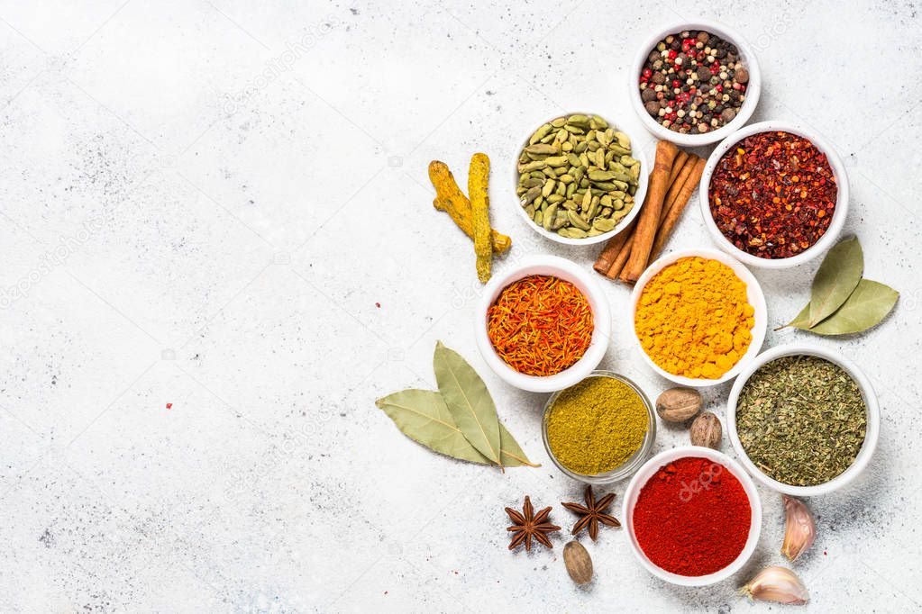 Spices on white stone table.