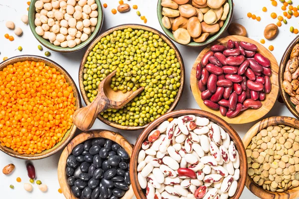 Legumes, lentils, chikpea and beans assortment on white. — Stock Photo, Image
