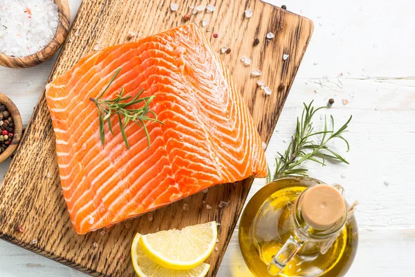 Salmon fillet with ingredients for cooking - fresh vegetables a — Stock Photo, Image