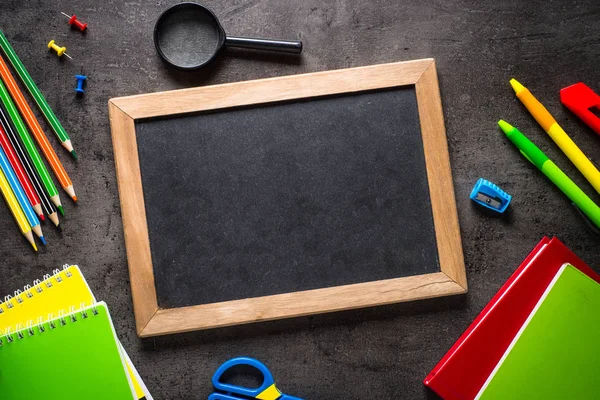 Papelaria escolar e de escritório sobre fundo preto . — Fotografia de Stock