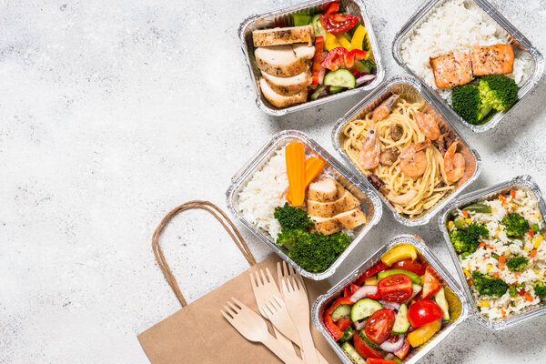 Food delivery concept - healthy lunch in boxes.