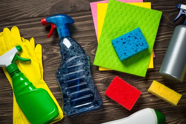 Cleaning product, household wooden table top view.