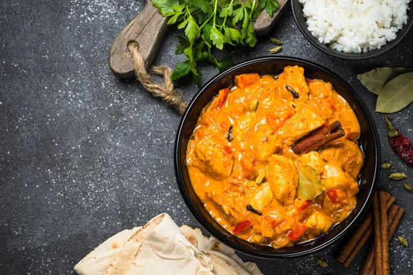 Chicken tikka masala with rice on black top view. — Stock Photo, Image