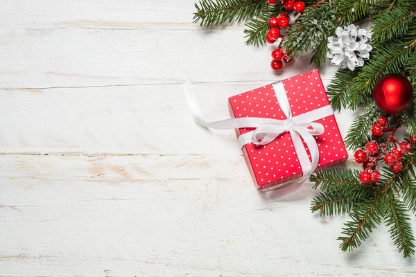 Christmas background with fir tree, present box and decorations