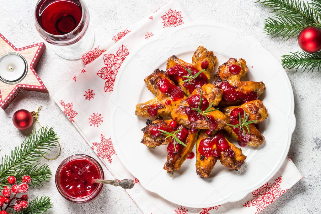 Baked chicken wings in cranberry sauce.