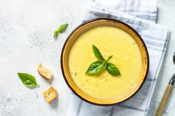 Zucchini Cream soup with basil and croutons on white. — Stock Image Zucchini Cream soup with basil and croutons on white. Stock Photo