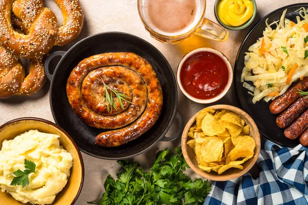 Oktoberfest food - sausage, beer and bretzel. — Stock Photo, Image