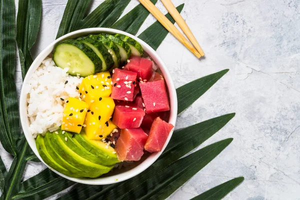 Tuna poke bowl with rice and vegetables.