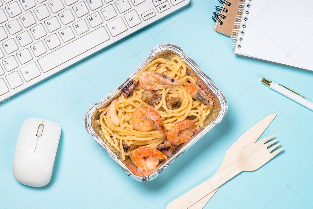 Food delivery concept - healthy lunch on office table.