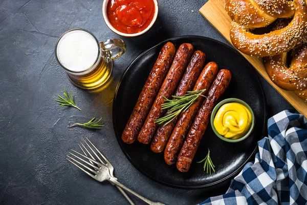 Oktoberfest food - sausage, beer and bretzel. — Stock Photo, Image