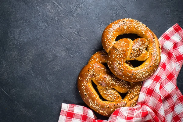 Oktoberfest food beer and bretzel on black.