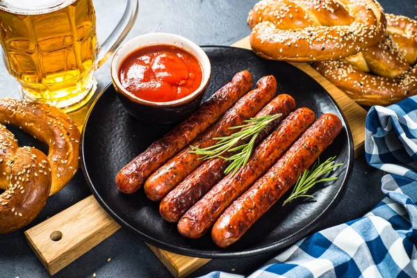 Grilled sausage in black iron pan. — Stock Photo, Image