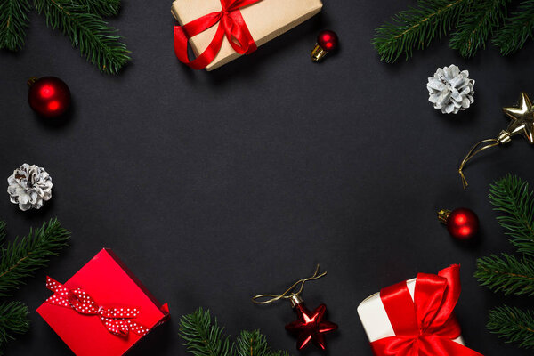 Christmas background with decorations on black.