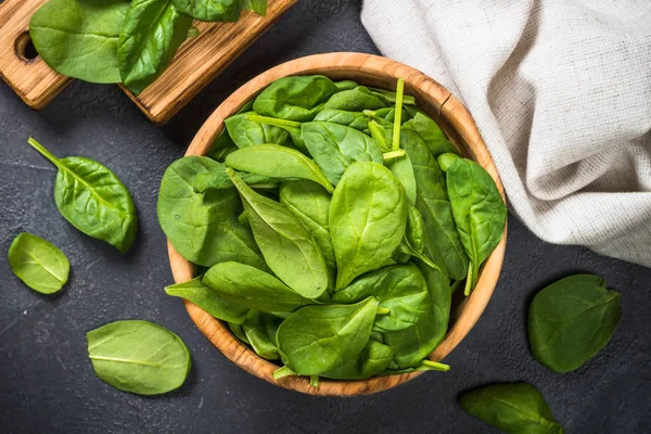 Baby spinach leaves on black background. — Stock Photo, Image