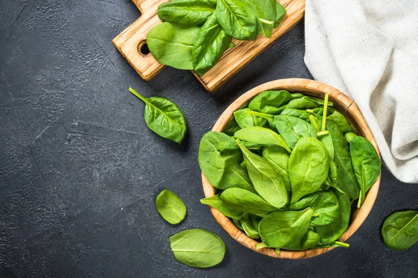 Baby spinach leaves on black background. — Stock Photo, Image