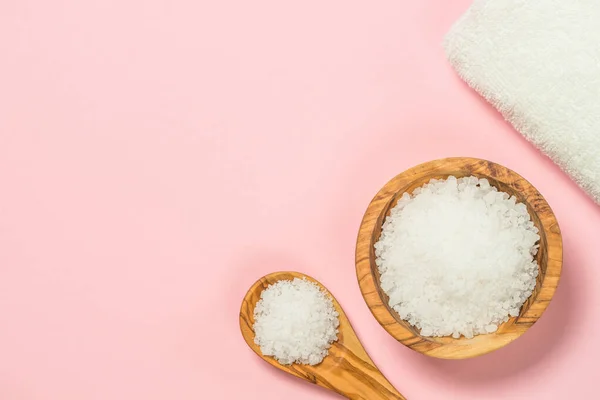 Spa flat lay background with sea salt and towel on pink. — Stockfoto