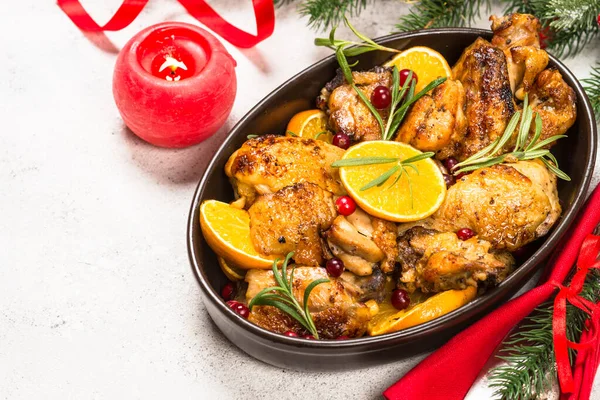 Christmas food - roasted chicken with orange on white table. — Stock Photo, Image