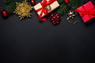 Christmas background with decorations on black. clipart