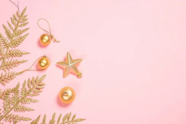 Golden Christmas flat lay background on pink. — Stock Photo, Image