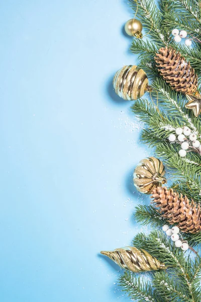 Christmas flatlay background - fir tree and decorations on blue top view. — Stock Photo, Image
