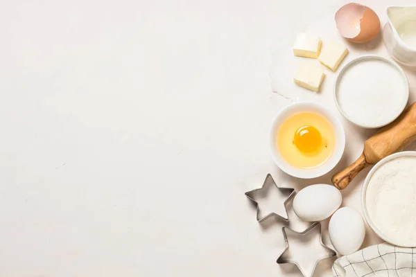 Baking ingredients at blue table top view. — Stock Photo, Image