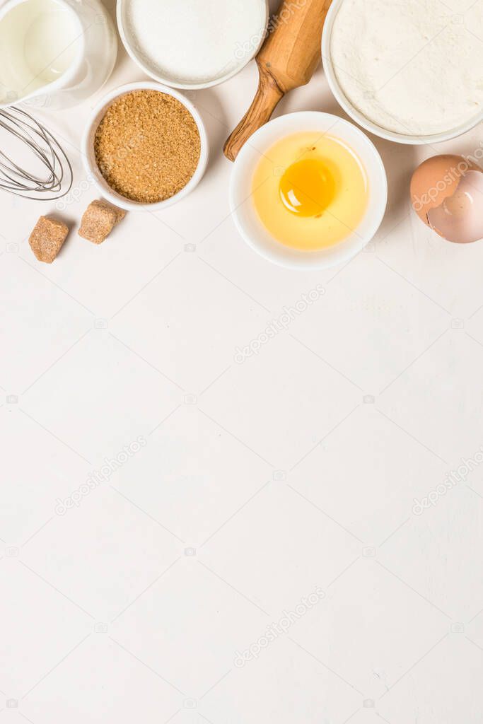 Baking ingredients at blue table top view.