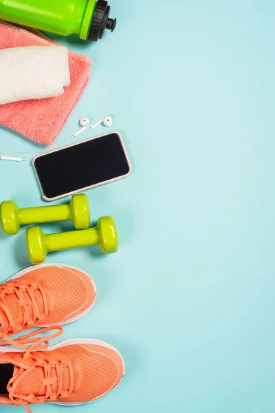 Fitness equipment at blue background top view. — Stock Photo, Image