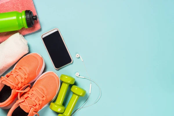 Fitness equipment at blue background top view. — Stock Photo, Image