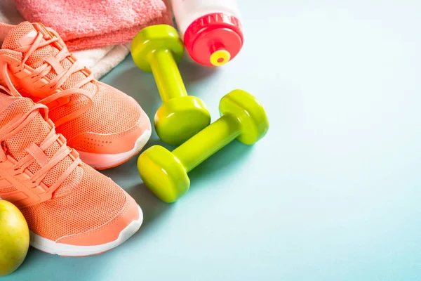 Fitness equipment at blue background top view. — Stock Photo, Image