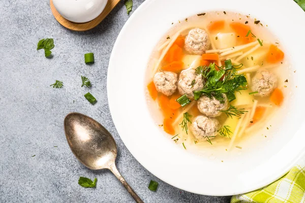 Meatballs soup with vegetables top view. Royalty Free Stock Photos