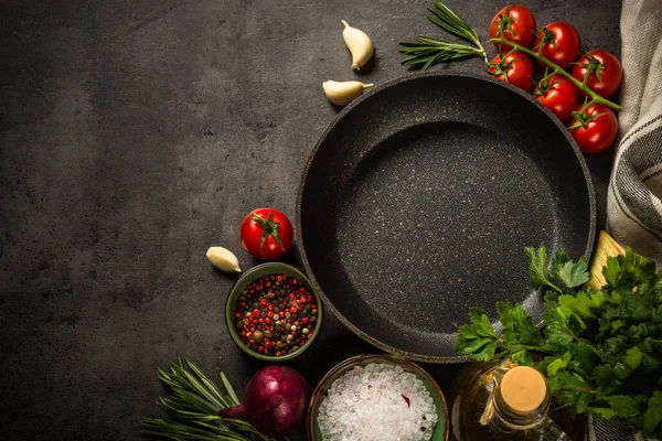 Ingredients for cooking at black table.