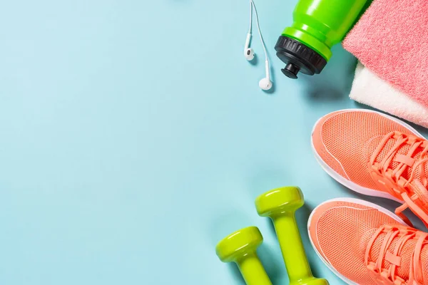 Fitness equipment at blue background top view. — Stock Photo, Image