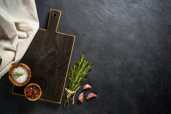 Food cooking background with herbs and spices on black. — Stock Photo, Image