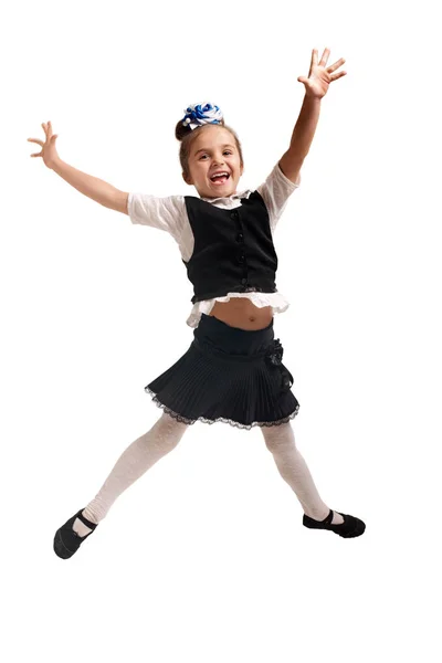 Счастливая школьница прыгает — стоковое фото