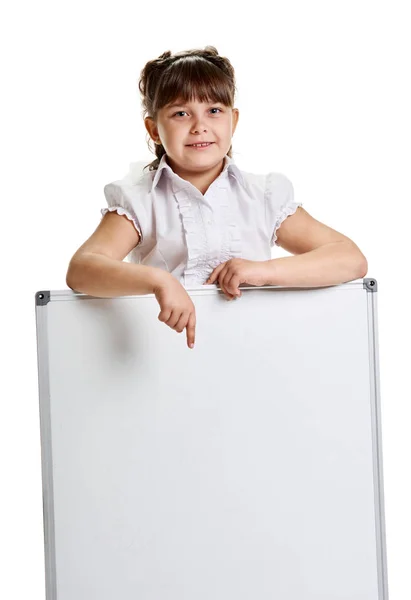 Schoolgirl pointing on whiteboard — Stock Photo, Image