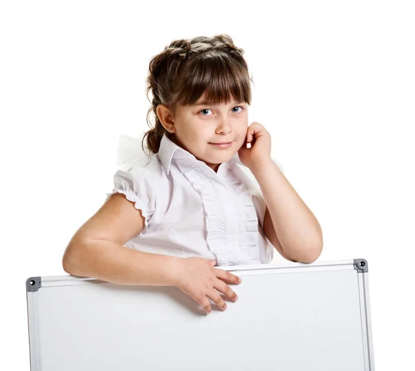 Schoolgirl pointing on whiteboard — Stock Photo, Image