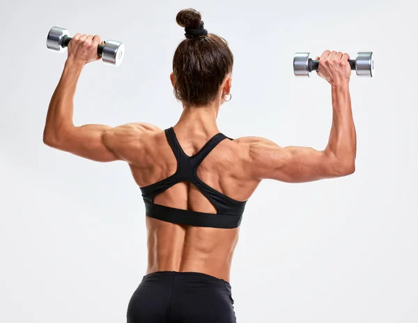Woman bodybuilder from back — Stock Photo, Image