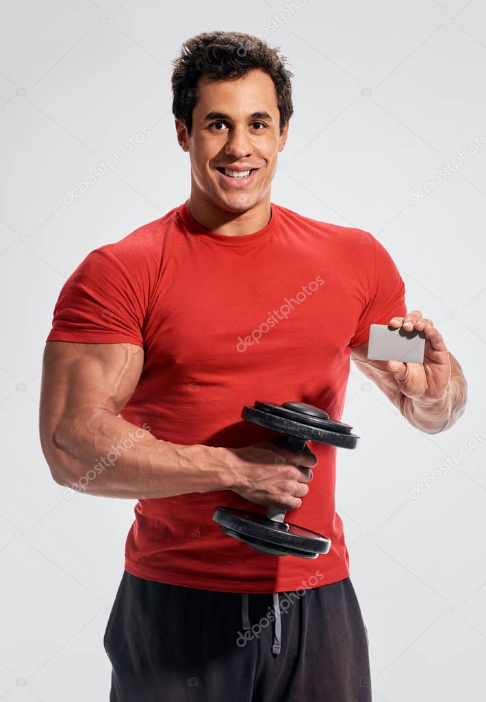Strong and power bodybuilder with empty card