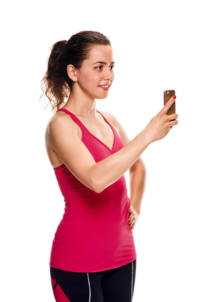 Fitness Woman with smartphone taking selfie — Stock Photo, Image