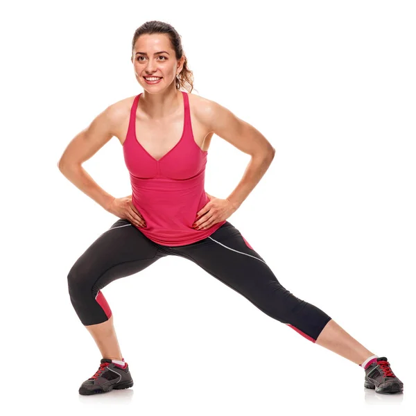 Smiling fitness woman warming-up — Stock Photo, Image