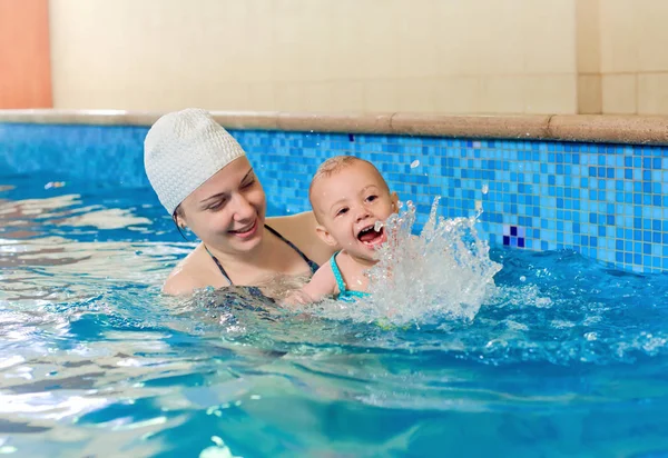 Cheerful baby swimming — Stock Photo, Image