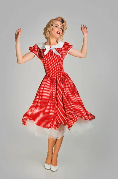 Pinup girl in spotted dress — Stock Photo, Image