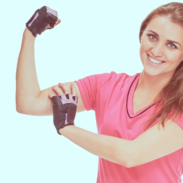 Sportswoman showing biceps — Stock Photo, Image