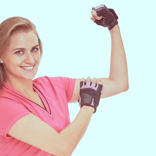 Sportovní žena ukazující biceps — Stock fotografie