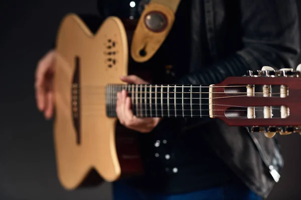 Musician holding the guitar